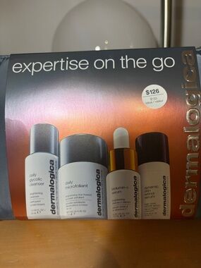 dermalogica skincare travel set - orange gradient with white and gold accents